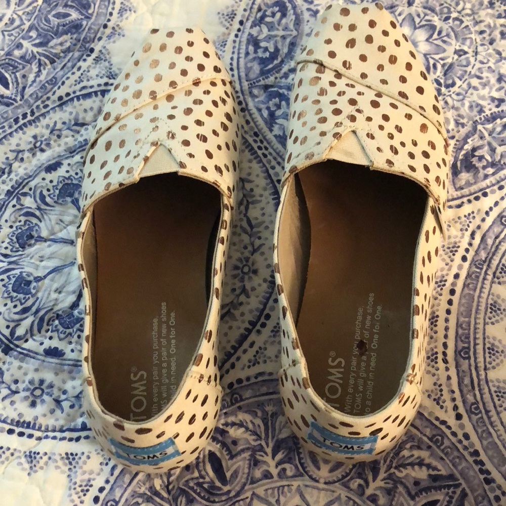 Tan and gold polka dotted Toms shoes